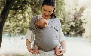 Woman wearing a baby in a wrap